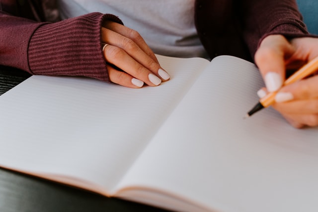 Woman writing in a notebook