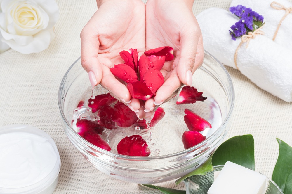Rose petals in a bowl of water.