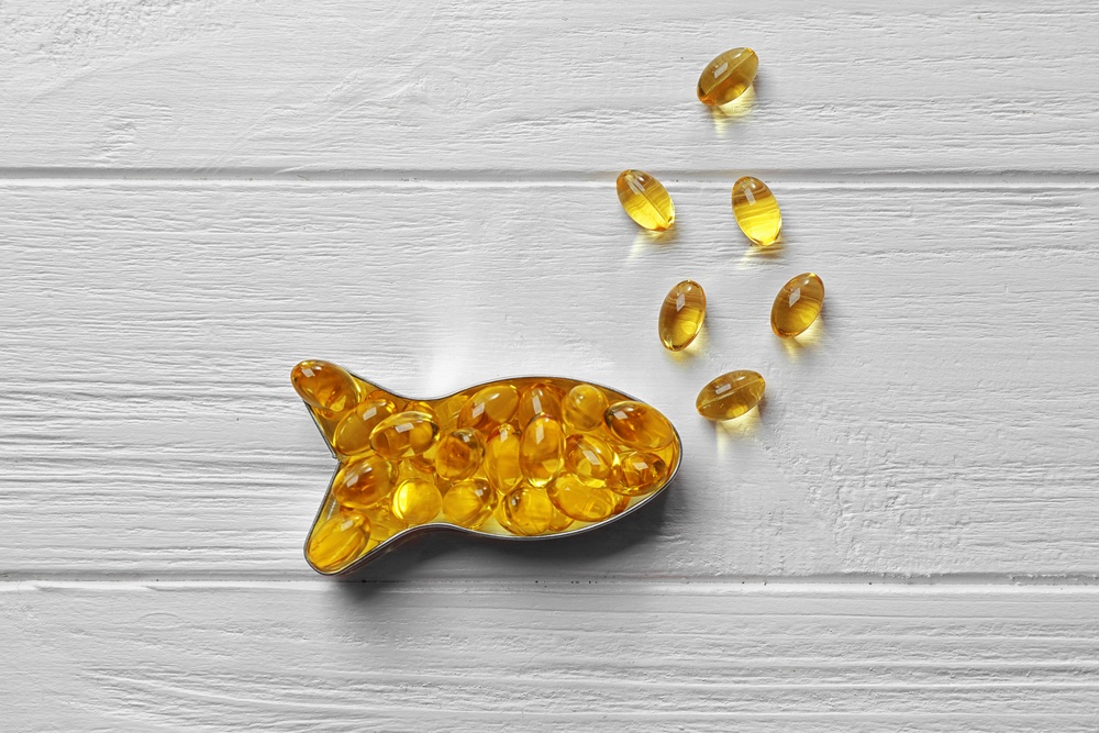 Fish oil supplements in the shape of a fish.