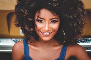 smiling woman with natural curls
