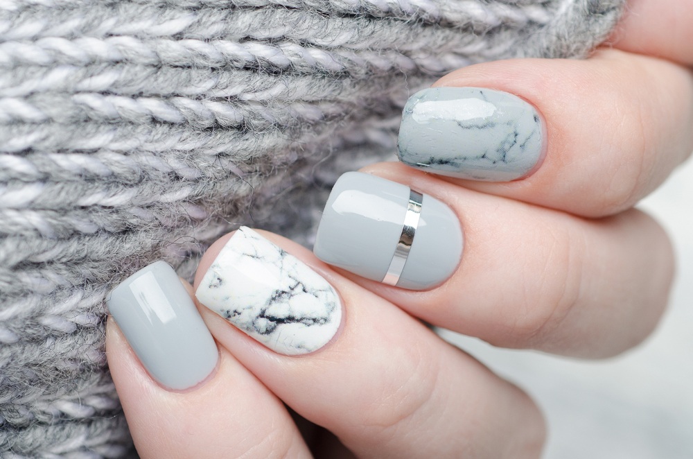 gray painted nails with granite effect
