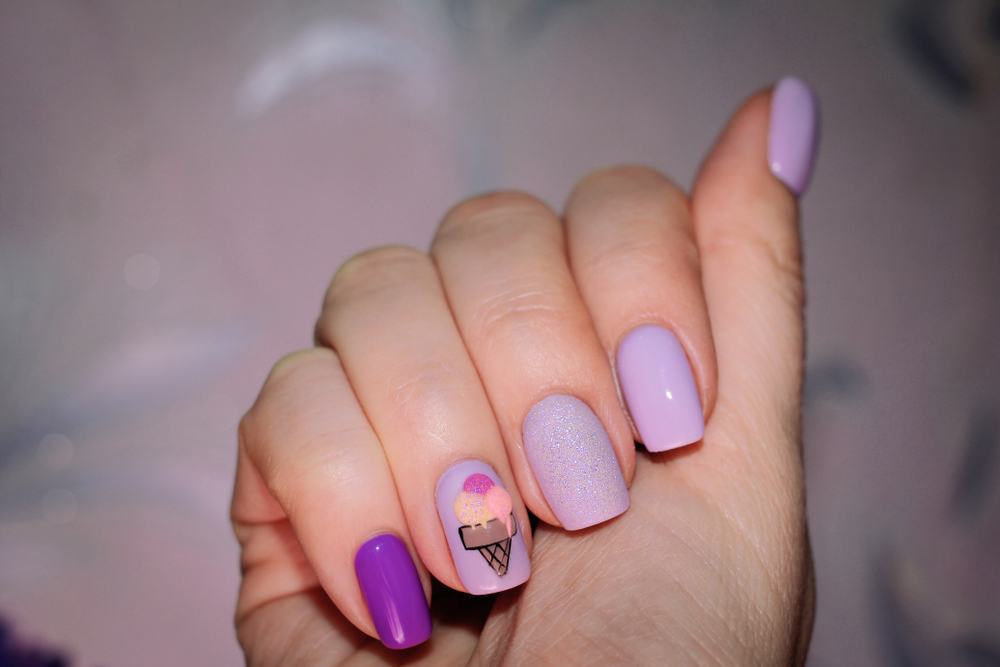 purple painted nails with ice cream cone design