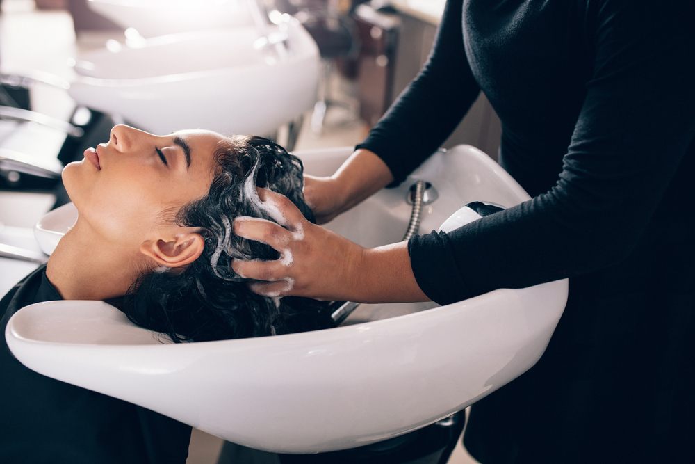 woman having her hair washed at a hair salon