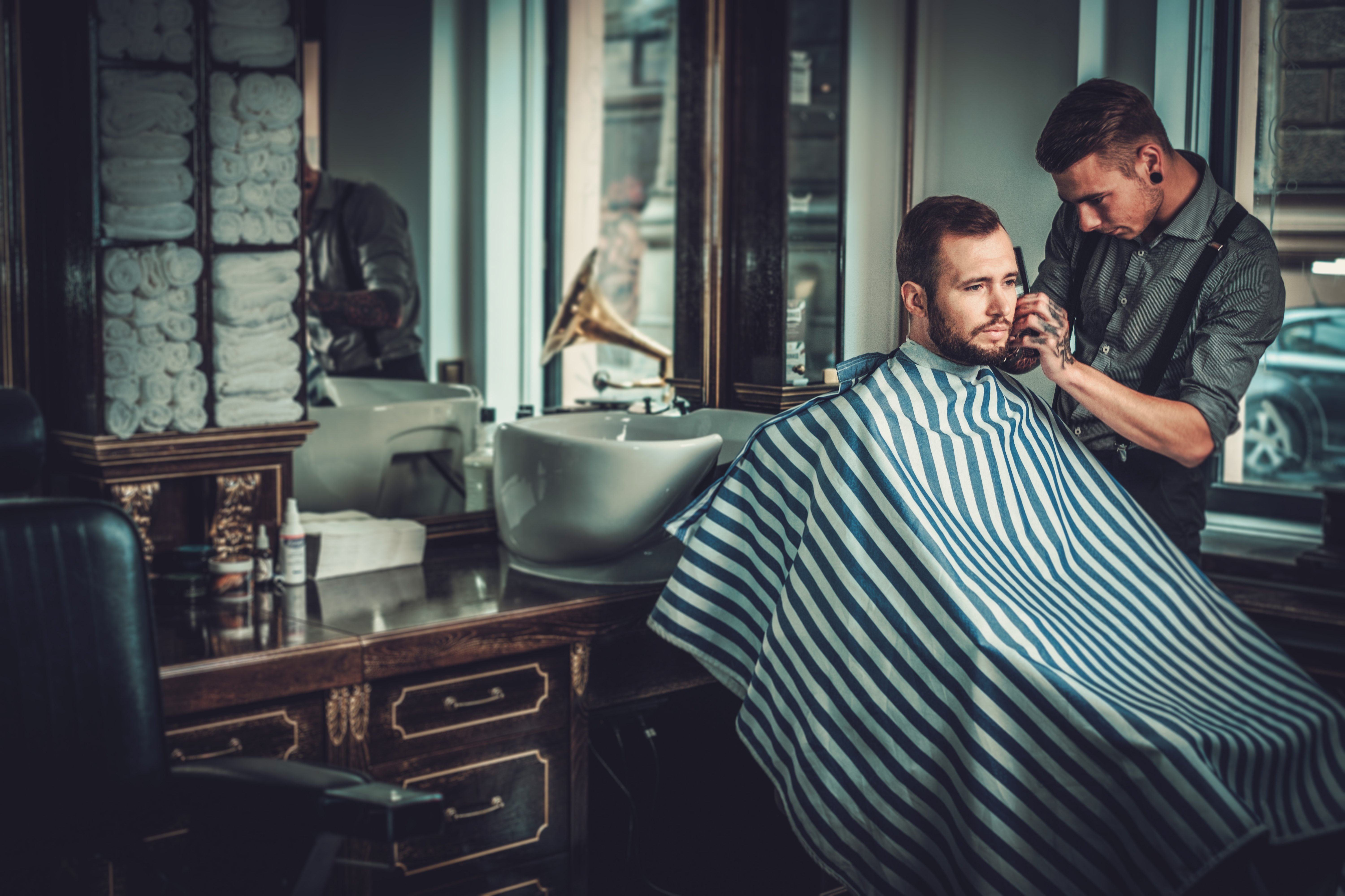 barber cutting a man's hair