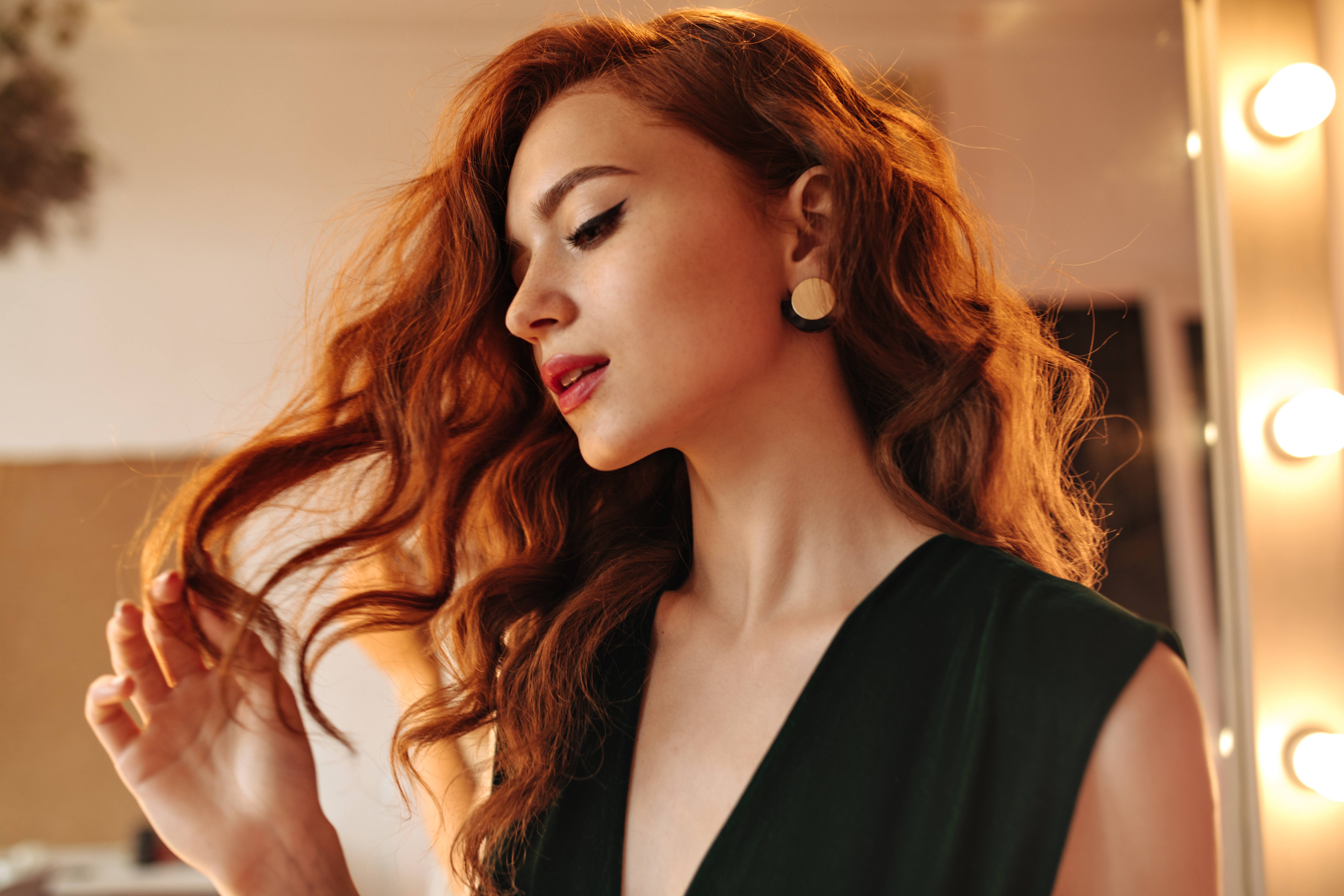 gorgeous woman with elegant dress, big waves, and red lipstick